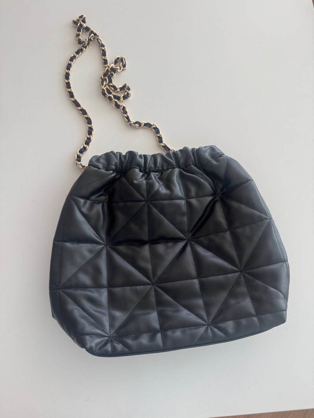 Black Quilted Drawstring Crossbody Bag with Gold Chain